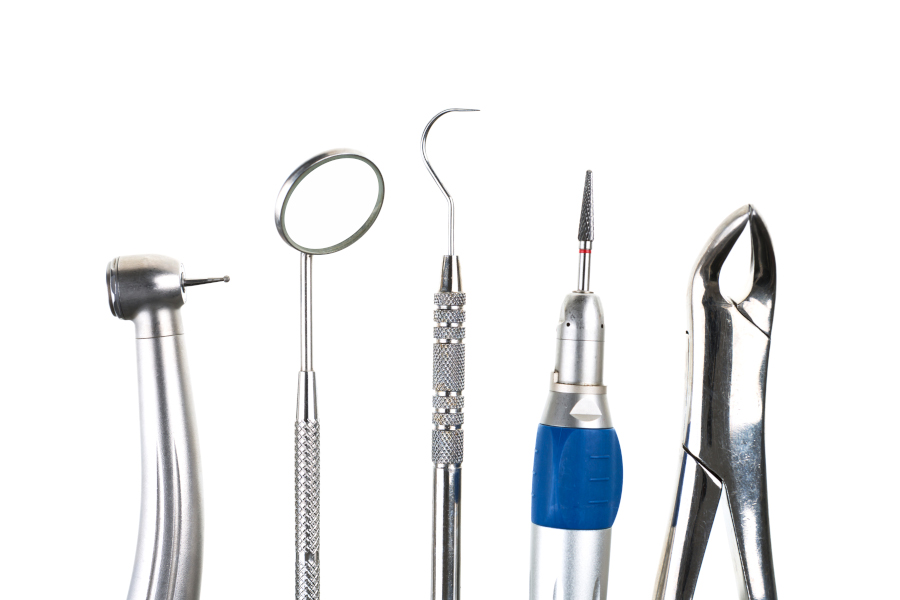 Top view of medical examination tools standing on table in empty modern doctor office ready for health care consultation. Hospital workplace equipped with professional instruments. Medicine support