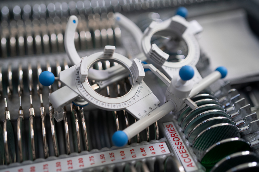 Top view of medical examination tools standing on table in empty modern doctor office ready for health care consultation. Hospital workplace equipped with professional instruments. Medicine support